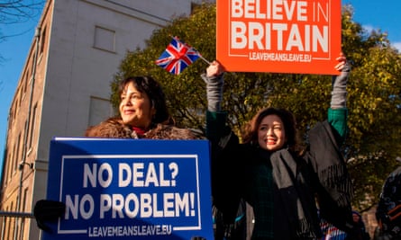 Activists hold up placards from the Leave Means Leave campaign group outside the Houses of Parliament this month.