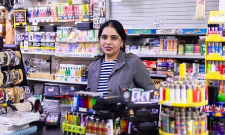 Lakmir Kaur behind the counter of her gift shop