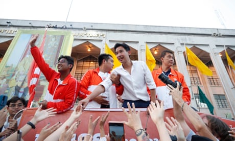 Move Forward Party's leader and prime ministerial candidate Pita Limjaroenrat greets supporters during a caravan parade to thank voters after winning the general election
