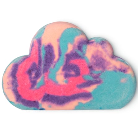 Lush Sleepy Bubble Bar. The bar is in the shape of a cloud and has a marbled pattern in cyan magenta purple and peach.
