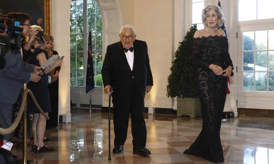 Kissinger and his wife, Nancy Kissinger, arrive for a State Dinner at the White House in 2019.