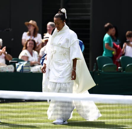 Naomi Osaka arrives ahead of her women’s singles first round tennis match with a white kanzashi hair ornament in her pulled back hair