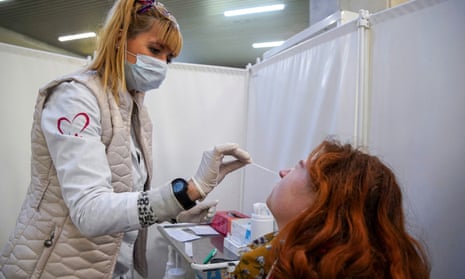 A woman is getting tested for Covid-19 at a metro station in Moscow.