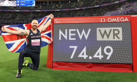 Dan Pembroke celebrates setting a world record in winning gold in the F13 javelin in the Stade de France.
