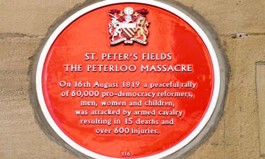 Red plaque commemorating the Peterloo massacre in Manchester.
