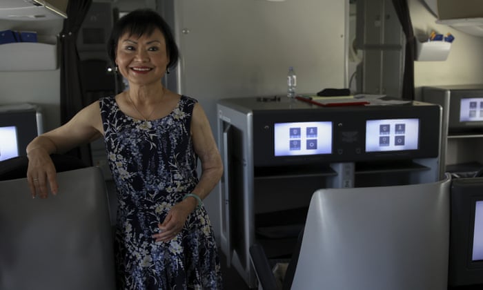 Kim Phuc poses for a picture in a humanitarian flight transporting refugees fleeing the war in Ukraine to Canada, from Frederic Chopin Airport in Warsaw, Poland, Monday, July 4, 2022.