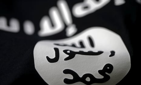 An Islamic State flag is seen in this picture illustration