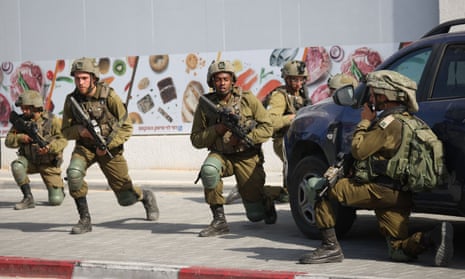 Israeli soldiers are deployed on Saturday in response to the Hamas attack on Israel.