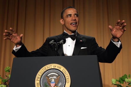 a man in a tuxedo speaks into a microphone