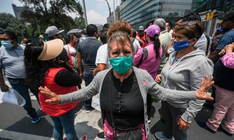 Merchants who were forced to shut their businesses due to the economic crisis caused by COVID-19 novel coronavirus pandemic, demand financial support from the government during a protest along Reforma Avenue in Mexico City.
