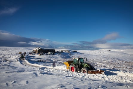 A snow plough clears a route through the snow