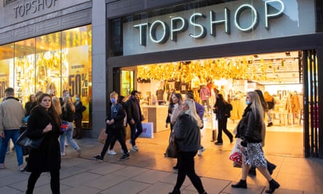 Shoppers in Oxford street pass a Topshop in London