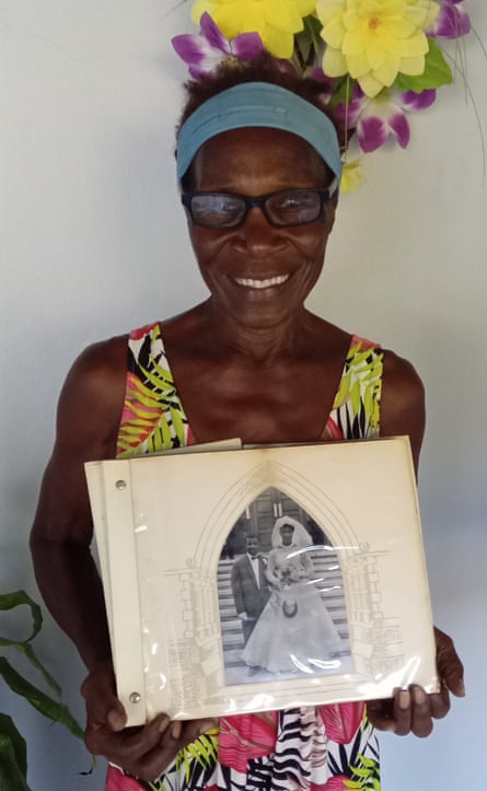 Gloria Wilson, at her home in St Ann, Jamaica, shows a photo from her 1962 wedding in the UK.