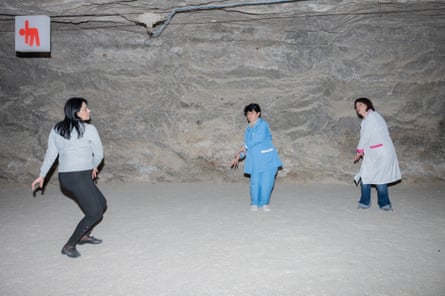 Anush Voskanyan, left, and Alvart Alihanyan, right, do breathing and fitness exercises with patient Marine Koklyan.