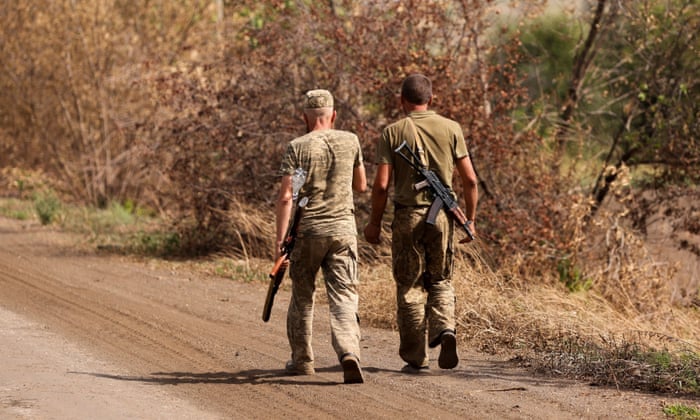 Ukrainian servicemen patrol following recent Russian shelling, as Russia’s attack in Ukraine continues, in Vasiukivka, in Donetsk region, Ukraine August 28,2022. REUTERS/Ammar Awad