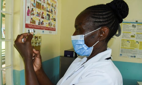 A nurse prepares a malaria vaccine at a hospital in Yala, Kenya, 7 October 7 2021