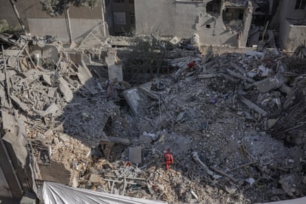 Emergency workers sifting through rubble