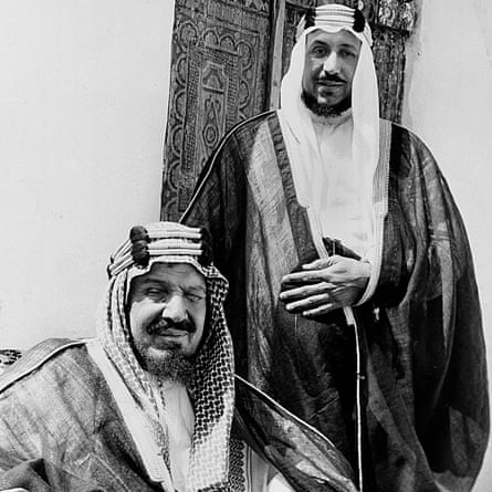 The founding monarch of Saudi Arabia, King Abdulaziz, seated, poses with his son Prince Saud.