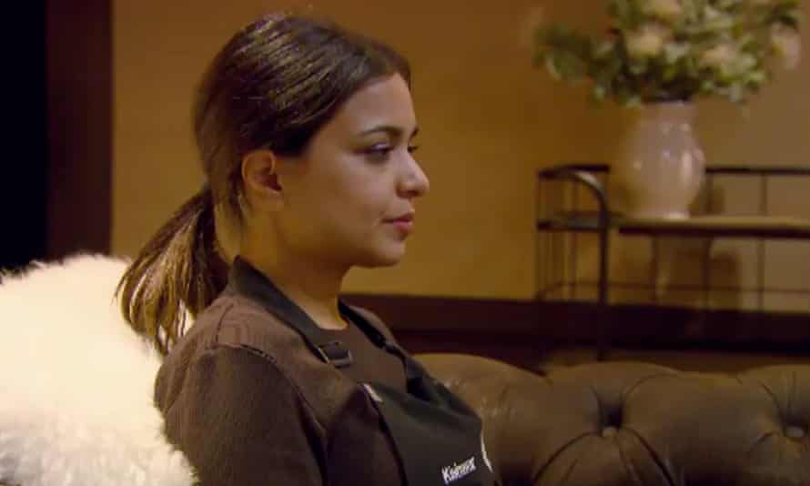 woman with pony tail sits in profile