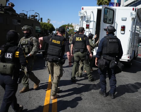 Drug Enforcement Administration (DEA) agents alongside other law enforcement officers work the scene near MacArthur Park in Los Angeles after federal authorities made arrests on charges related to selling illicit drugs on 6 May 2026.