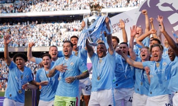 Manchester City’s Kyle Walker lifts the Premier League trophy after the final-day 3-1 victory over West Ham.