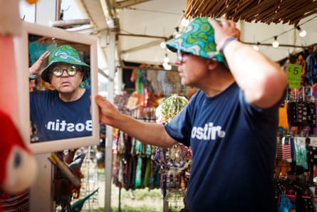 Adrian Chiles tries on a colourful bucket hat