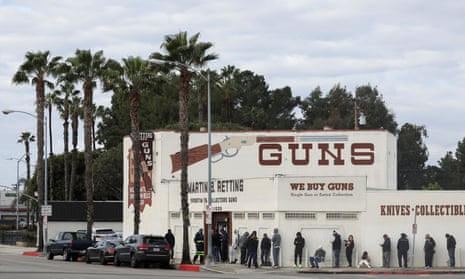 People wait in line outside to enter a gun store in Culver City, California, in March 2020.