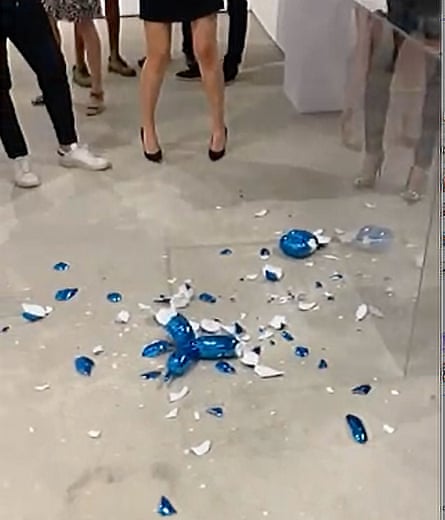 Fragments litter the gallery floor after the accident involving the Jeff Koons sculpture.