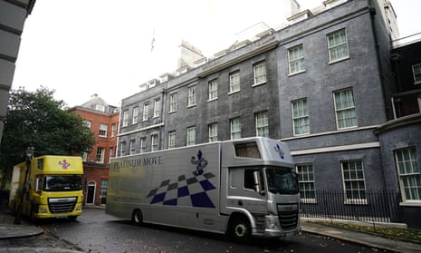 Removal vans in Downing St