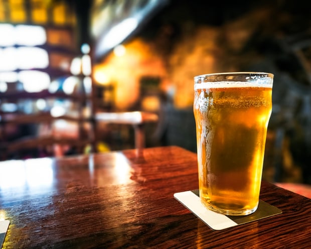 A pint of beer on a table