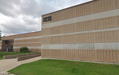 Exterior of the Fargo Police building with signage under a cloudy sky