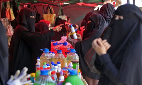 Women shop for disinfectant at a market in the Yemeni capital, Sana’a, amid concerns about the Covid-19 pandemic.