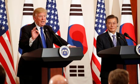President Donald Trump talks to journalists alongside South Korea's president Moon Jae-in at a news conference in Seoul