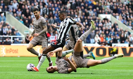 13 April 2024 Alexander Isak scores of Newcastle’s opening goal against Tottenham as Micky van de Ven falls to the ground at St James’ Park. Newcastle won 4-0.