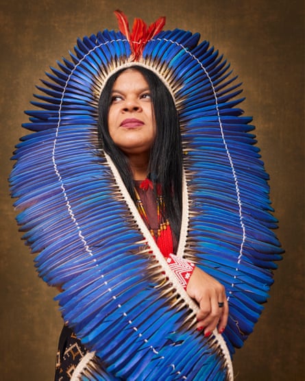 Sonia Guajajara, Brazil’s first minister of Indigenous peoples, wearing a blue ceremonial headdress.