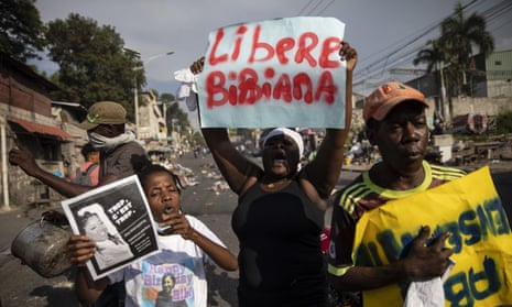 People chant anti-government slogans during a 27 September protest organized by friends and relatives of Biana Velizaire, who was kidnapped and held for several days by gang members in Haiti.