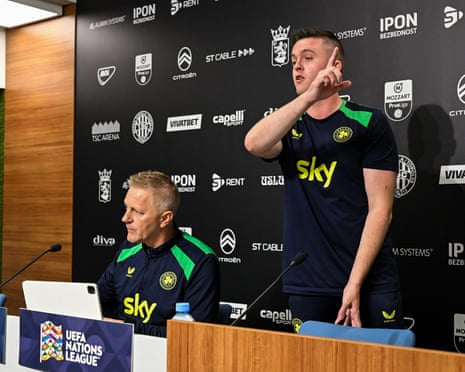 IrelandâÂÂs press officer Kieran Crowley signals an end to the RepublicâÂÂs media briefing alongside head coach Heimir Hallgrimsson
