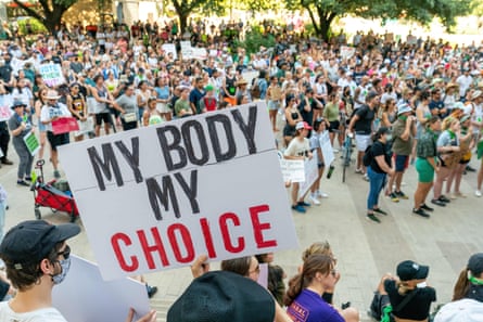 Abortion rights activists hold a “My Body My Choice” sign during a rally