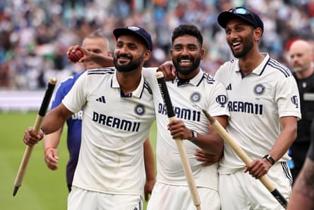 India’s Akash Deep (left) and India’s Prasidh Krishna (right) hold the stumps, and India’s Mohammed Siraj holds the match ball after taking five wickets.