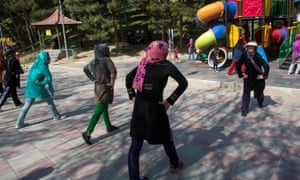 Iranian women exercise together in a central Tehran park.