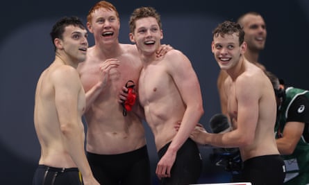 James Guy, Tom Dean, Duncan Scott and Matthew Richards celebrate after winning gold in the men’s 4x200m freestyle relay in Tokyo