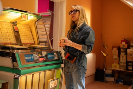 Back to Black director Sam Taylor-Johnson alongside the AMI jukebox once owned by Winehouse.