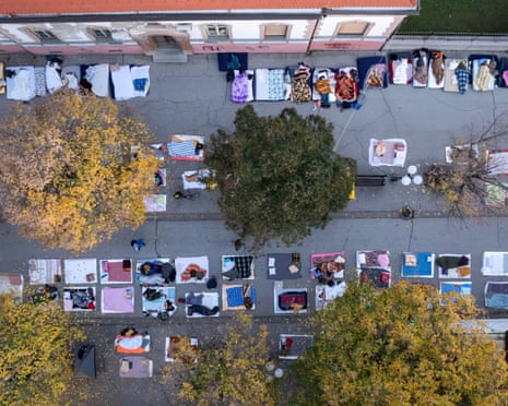 Aerial view of students sleeping on mats