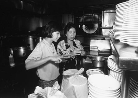 Nguyet Vu, right, and her daughter Chau working in the kitchen of Kim Anh.