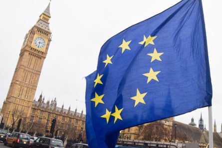 An EU flag flies outside the Houses of Parliament and Big Ben.