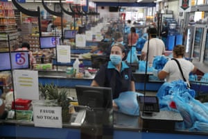 A supermarket in Miami, Florida. Many immigrants are working in essential roles that keep the US operating amid the virus.