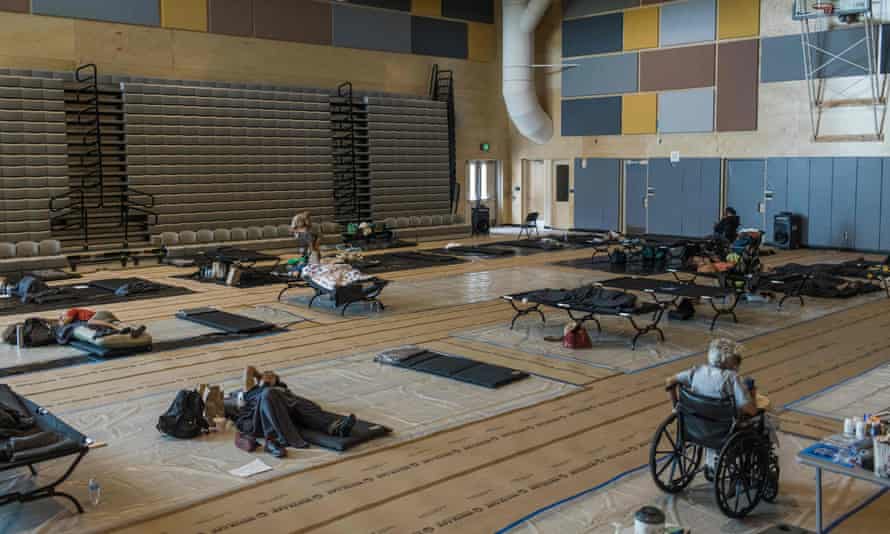 People at a cooling center at Kellogg middle school in Portland, Oregon.