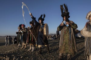 A group of shamans throw milk