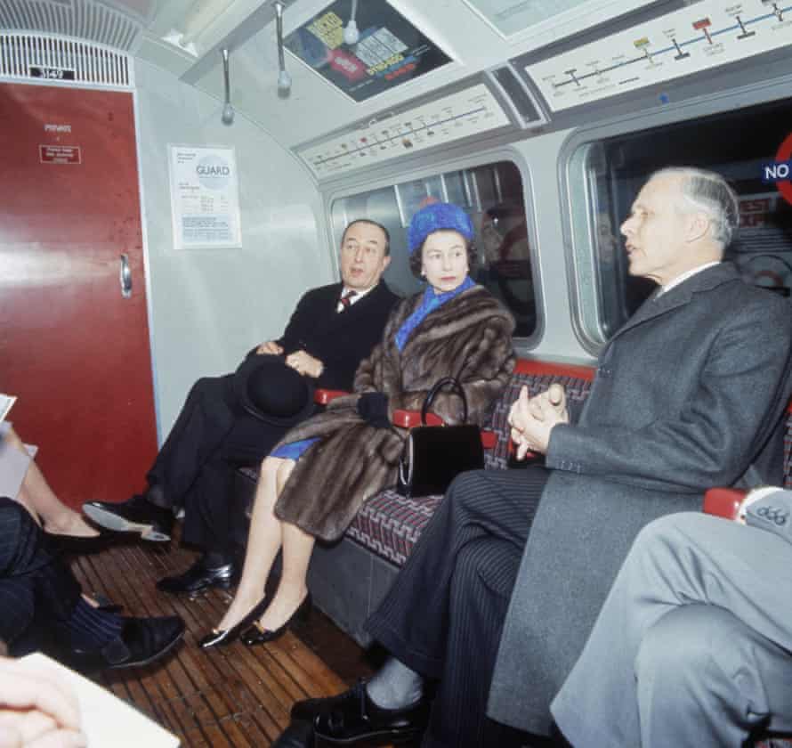 Queen Elizabeth II travels on a tube train after the official opening of the Victoria line in March 1969