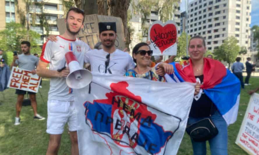 Neb Jovanovic (far left) and other Djokovic supporters outside the hotel on Monday night.